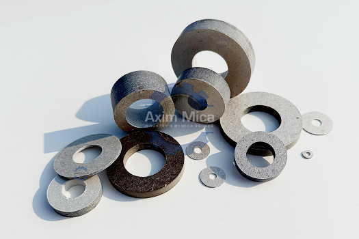 Mica washers providing electrical isolation and current leakage prevention in motor assemblies